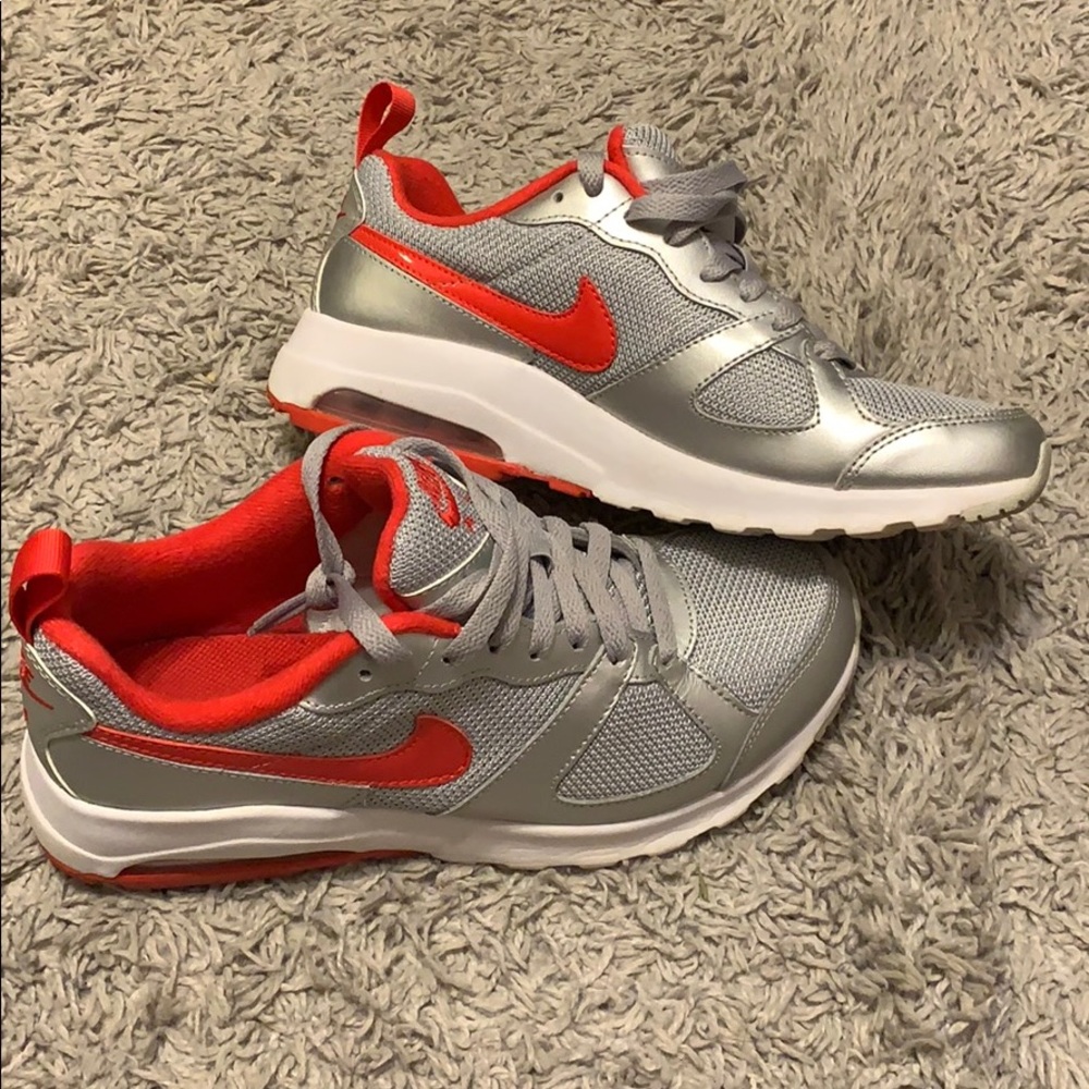 Red and silver Nike sneakers